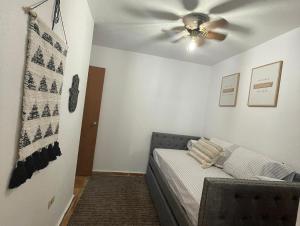 a bedroom with a bed with a ceiling fan at La Kolina Reserve in Ponce +13 photos
