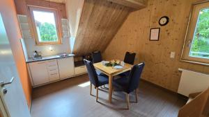 a dining room with a table and chairs at Natur Apartments Natalia in Fürth