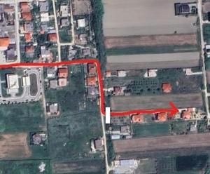 an aerial view of a city with houses and roads at Rent Rooms Sakolli in Berat