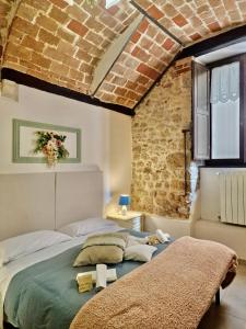 A bed or beds in a room at Casa Adua by TraMonti Apartments