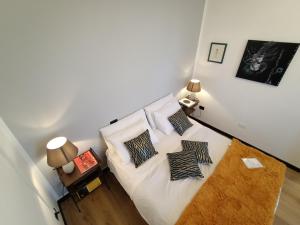 Postel nebo postele na pokoji v ubytování ArtGallery - Suite Superior due camere matrimoniali in Villa