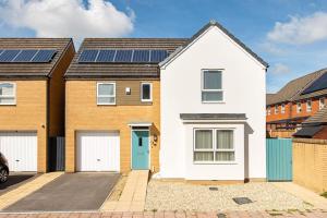 an image of a house with solar panels on the roof at Home in Patchway in Bristol