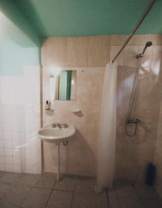 a bathroom with a sink and a shower at La Casita del Molino in Trevelin +32 photos