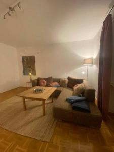 a living room with a couch and a coffee table at Im schönen Naheland bei Kirn in Meckenbach +1 photo