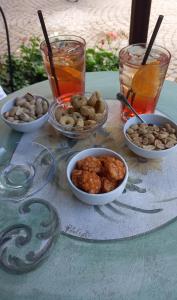 a table with bowls of food and drinks on it at Casa di Sara in Pescasseroli +26 photos