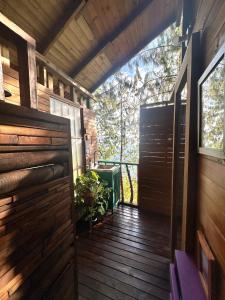an outside door of a house with a porch at LA CASA EN EL AIRE - Abejorral in Abejorral