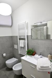A bathroom at AT HOME COLOSSEO