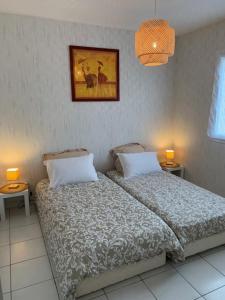 Ένα ή περισσότερα κρεβάτια σε δωμάτιο στο La Belle Escale