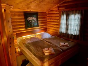 Letto o letti in una camera di Tiroler Blockhaus