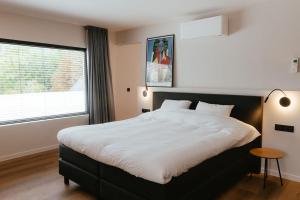 Postel nebo postele na pokoji v ubytování Ruime en Zonnige 5 sterren Vakantiewoning SVN7tien