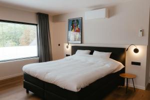 Postel nebo postele na pokoji v ubytování Ruime en Zonnige 5 sterren Vakantiewoning SVN7tien
