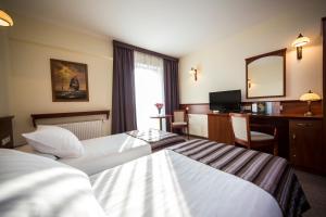 Łóżko lub łóżka w pokoju w obiekcie Hotel Great Polonia Conrad Kraków