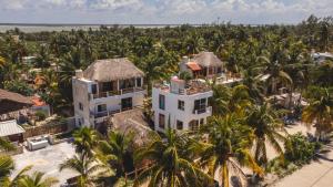 an aerial view of a resort with palm trees at Casa Iguana hotel boutique in El Cuyo