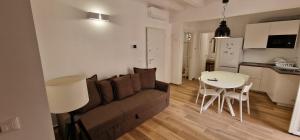 a living room with a couch and a table at Corte San Pietro -Apartments in Molfetta