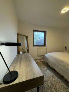 a bedroom with a bed and a lamp in it at Private apartment malmö in Malmö