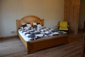 Postel nebo postele na pokoji v ubytování Hotel Mergera