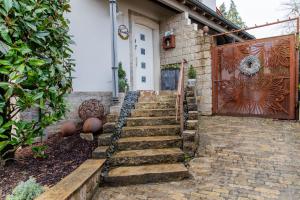 a set of stairs leading to a house with a gate at Laura‘s Heimat in Bad Bergzabern