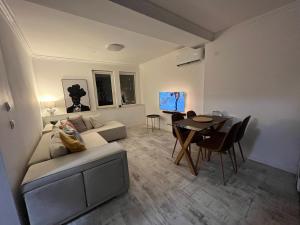 a living room with a couch and a table at Dido House Panoramic -Eurovision Fans Hub 2027 in Veliko Tŭrnovo