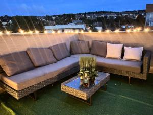 a couch sitting on top of a roof at Apartmán Manhattan s terasou v centre mesta in Trenčín