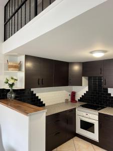 Kuchyň nebo kuchyňský kout v ubytování Beau duplex T3 bis bien situé