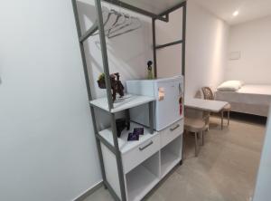 Postel nebo postele na pokoji v ubytování Marakí Suítes