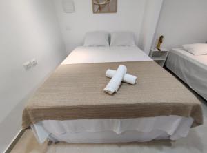 Postel nebo postele na pokoji v ubytování Marakí Suítes