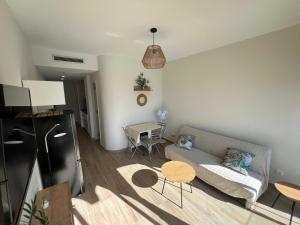 a living room with a couch and a table at Cura Sea View Apartment in Playa del Cura