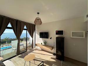a living room with a view of the ocean at Cura Sea View Apartment in Playa del Cura
