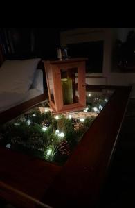 a room with a table with christmas lights on it at Mediterrán Vendégház in Zebegény