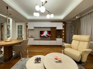 TV a/nebo společenská místnost v ubytování Apartman Madness