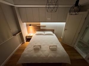 Postel nebo postele na pokoji v ubytování Apartman Madness