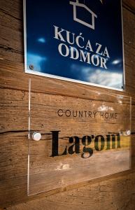 a sign for a country home lacomaru on a wall at Country home Lagom in Zagorska Sela
