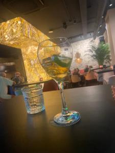 a wine glass sitting on top of a table at Villa Nita Altaona Golf Turquoise Sleeps 4 adults in Baños y Mendigo