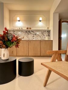 a living room with a table and a vase of flowers at Cà Bèla - Mercadante in Milan +75 photos