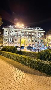 a large building with a street light in front of it at Karabakh boutigue-Hostel-apartment in Baku +85 photos