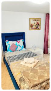 Postel nebo postele na pokoji v ubytování Cosy Duplex" Sidi Bou Said "
