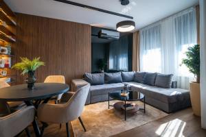 a living room with a couch and a table at The Residence 59 in Belgrade