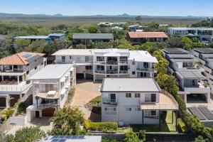 an aerial view of houses in a suburb at 4-18 Peregian Esplanade, Peregian Beach QLD 4573 in Peregian Beach