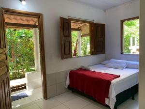 Postel nebo postele na pokoji v ubytování Quarto próximo à praia de Moreré