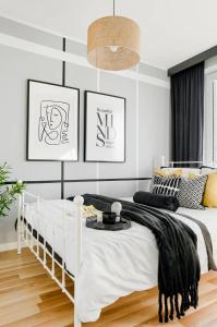 Ένα ή περισσότερα κρεβάτια σε δωμάτιο στο Apartament SWEET HOME