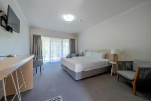 Postel nebo postele na pokoji v ubytování Woolgoolga Coast Motel