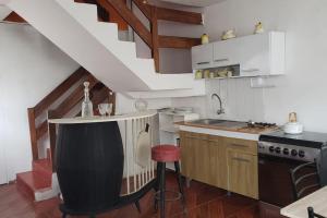 a kitchen with a counter and a sink and a stove at SAN PAOLY. in Trujillo