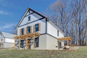 a white house with a gambrel roof at Luxury Barndo 2AS EuropeStyle Farm Stay Fresh Eggs in Jefferson City
