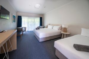 TV a/nebo společenská místnost v ubytování Woolgoolga Coast Motel