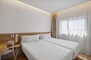 Postel nebo postele na pokoji v ubytování B&B HOTEL Viana do Castelo + 37 fotografií