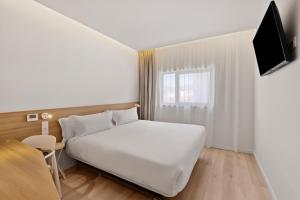 TV a/nebo společenská místnost v ubytování B&B HOTEL Viana do Castelo