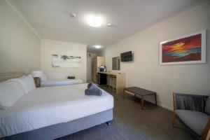 Postel nebo postele na pokoji v ubytování Woolgoolga Coast Motel