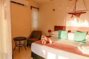 Postel nebo postele na pokoji v ubytování Hotel Puerto Holbox Beach Front