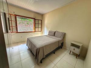 Katil atau katil-katil dalam bilik di parque cachoeira das andorinhas casa 2