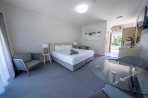 Postel nebo postele na pokoji v ubytování Woolgoolga Coast Motel